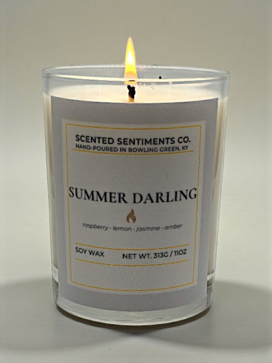 Scented candle labeled 'Summer Darling' by Scented Sentiments Co. on a neutral background